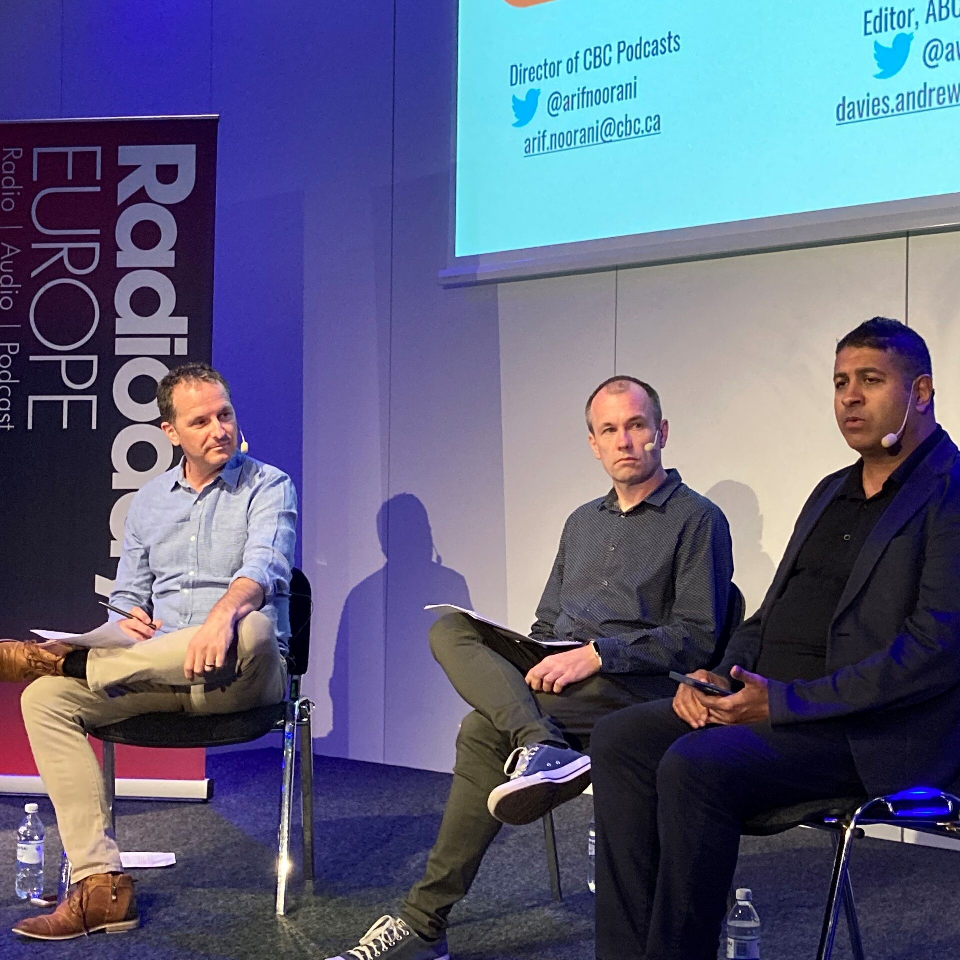 (From left to right) Tim Watkin, Andrew Davies, and Arif Noorani speaking at Radiodays Europe in May 2022.