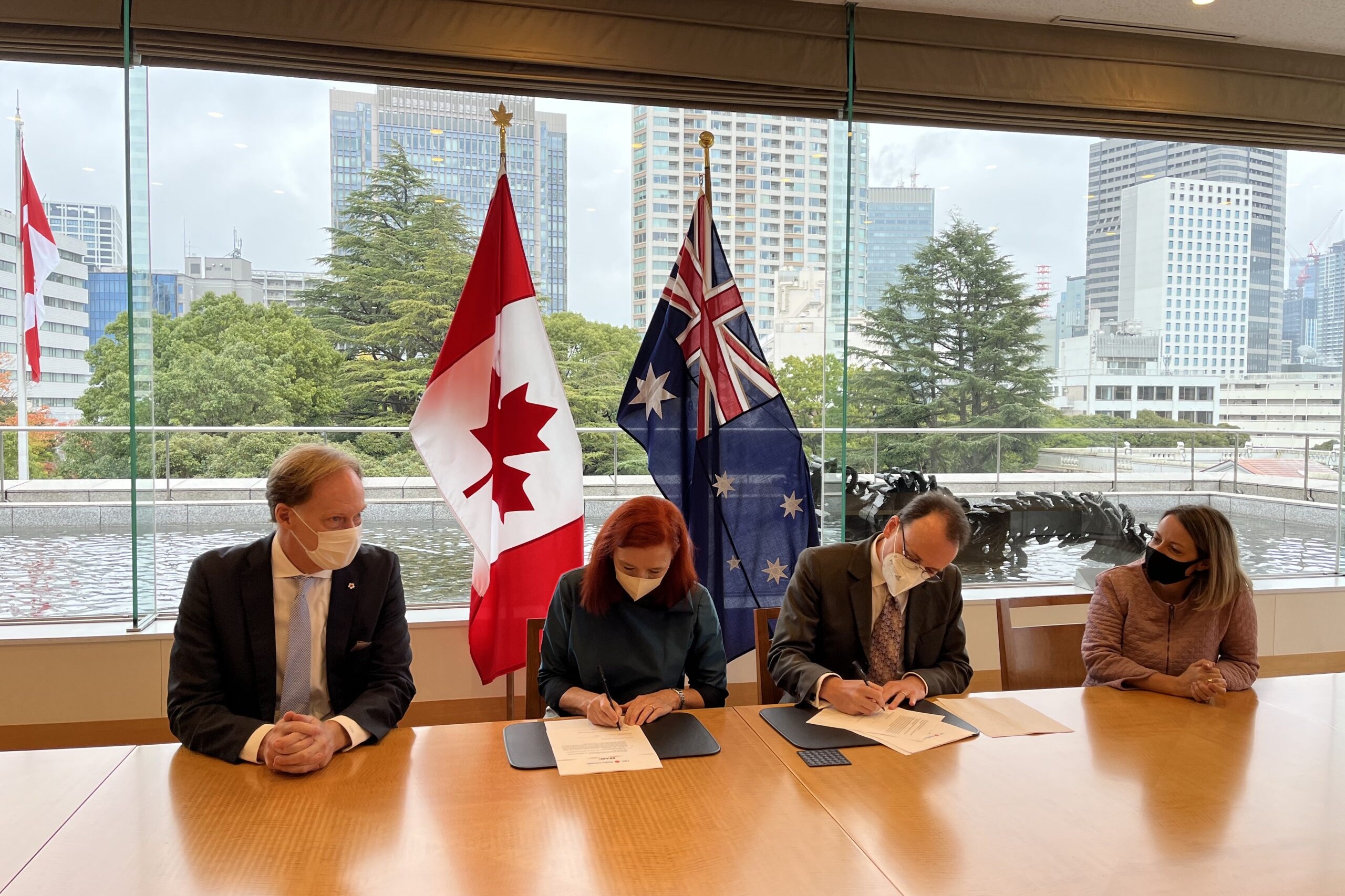 Catherine Tait, the President and CEO of CBC/Radio-Canada with David Sutton, Senior Strategist at ABC – on behalf of Managing Director, David Anderson – signing the Memorandum of Understanding at the Canadian Embassy in Tokyo, Japan.