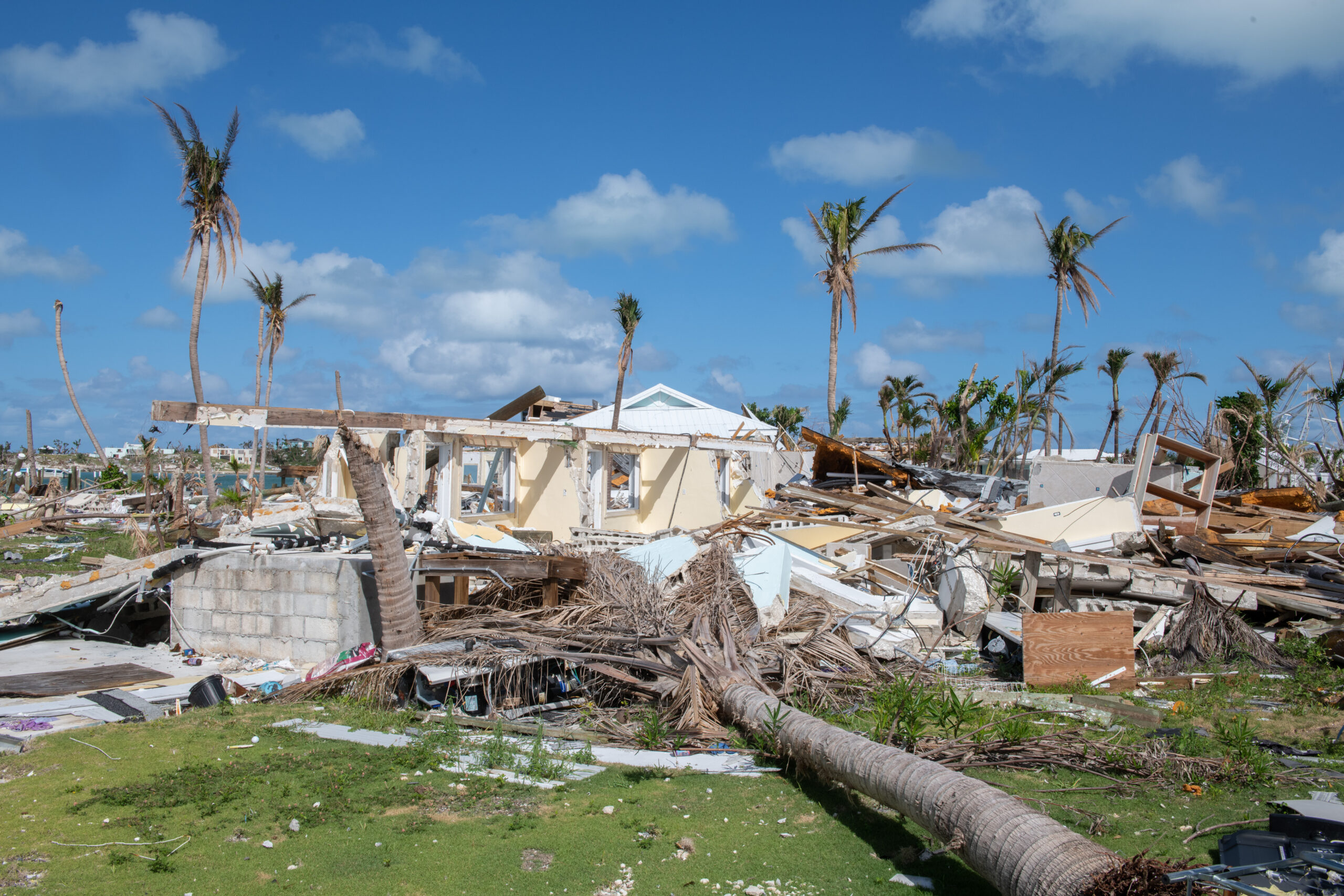 Image shows a house in rubble after being torn apart by a hurricane.