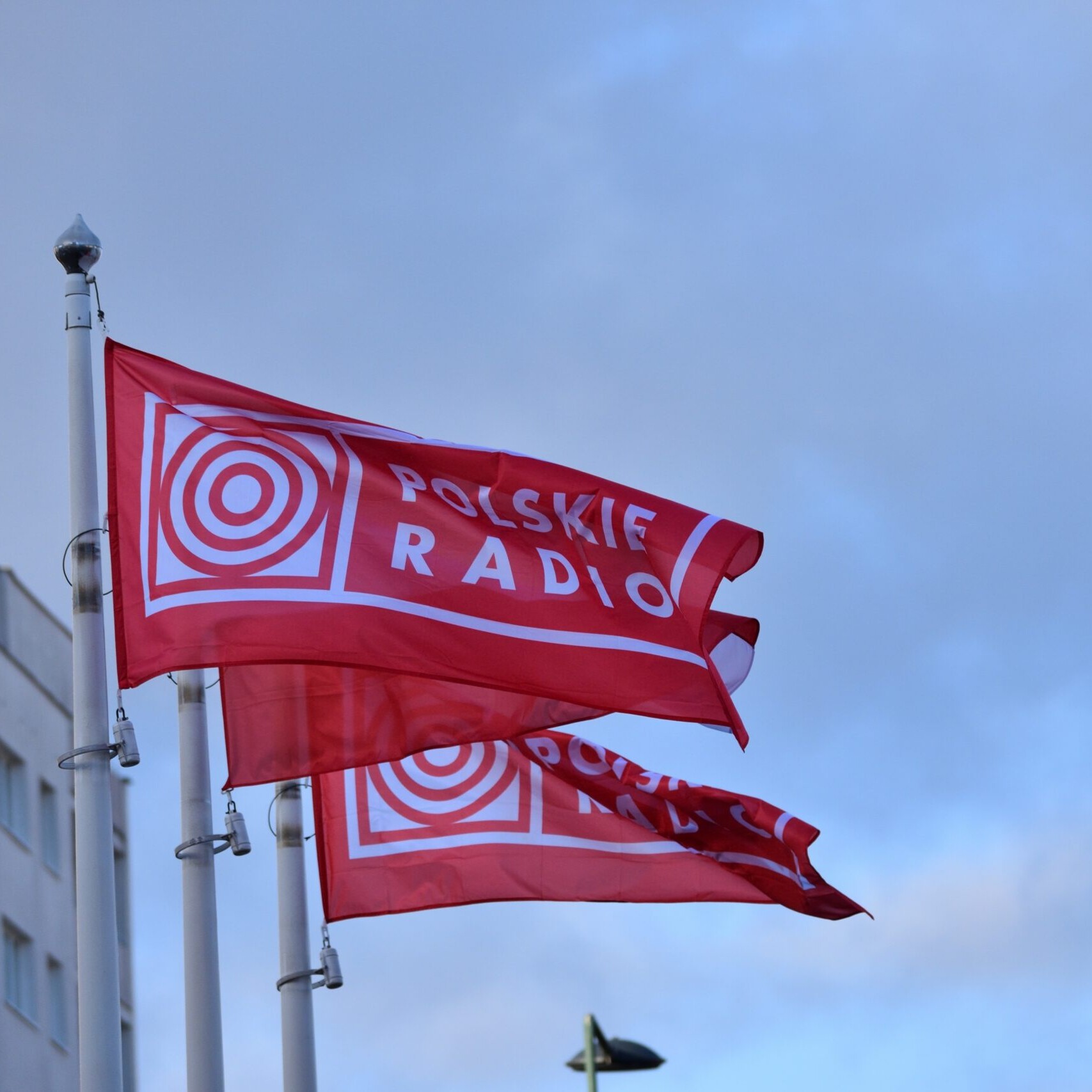 Polski Radio flags on a flagpole.