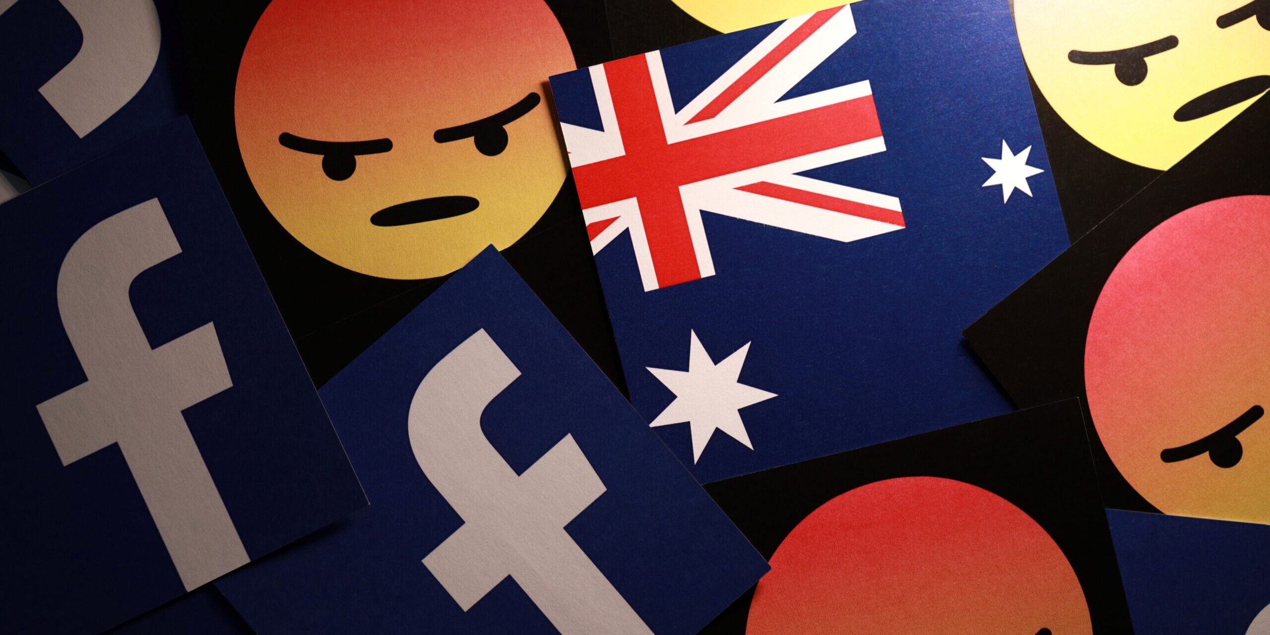Image of angry emojis, Facebook logo and Australian flag