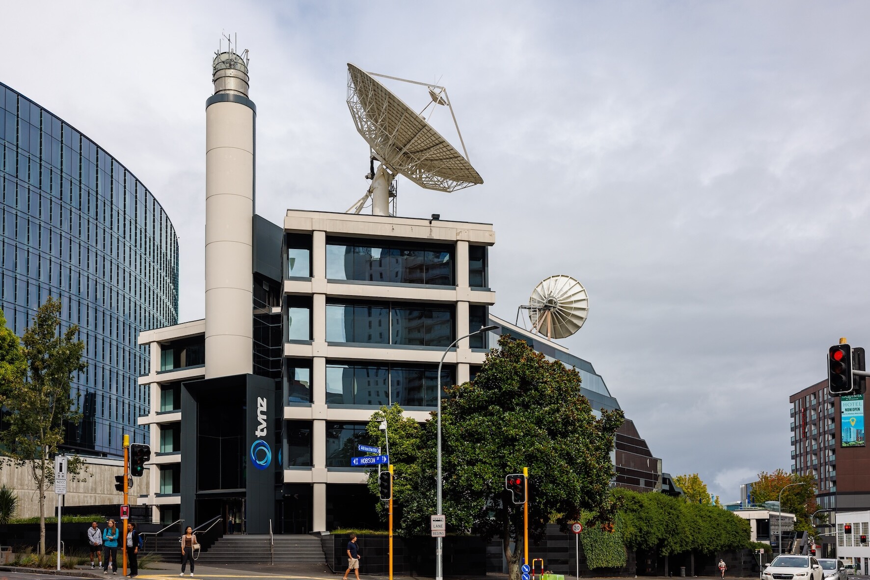 A building with a satellite dish on the roof.